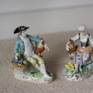 two Dresden man and lady figures with chickens